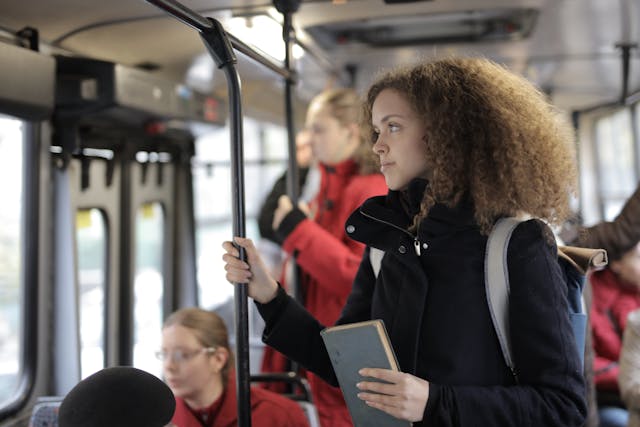 young woman riding the bus